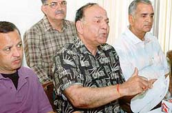 Punjab Petroleum Dealers Association president J.P. Khanna (centre) addresses reporters in Jalandhar 