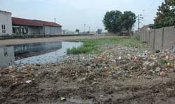 Waste matter littered along the boundary wall of Chhehratta Railway Station.