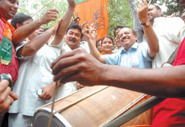 Delhi Pradesh BJP president Dr Harsh Vardhan with the supporters celebrating his party victory at Delhi Pradesh BJP office in the Capital.