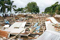 Destroyed homes lay in ruins after a tsunami struck the coast in Gizo in the Solomon Islands on Saturday. Several islands of the Solomons were hit by an earthquake on Monday, which measured 8.1, causing a tsunami.