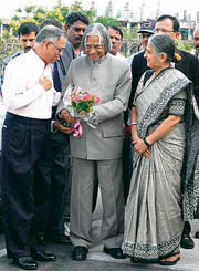 President APJ Abdul Kalam (centre) is presented with a bouquet of flowers by CEO and Chief Mentor of Infosys N.R. Narayana Murthy (left) as his wife Sudha Murthy (right) looks on during Kalam's visit to the Infosys Campus in Mysore.