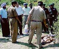 A police official explains the position the body was found in to Army personnel at Morni where Havaldar Gurjinder Singh was found dead.