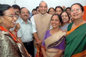 Delhi BJP president Dr Harsh Vardhan , BJP national president Rajnath Singh with newly elected women councillors in MCD election in the Capital on Sunday.