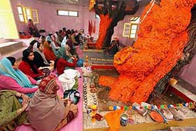 Devotees offer prayers at the 700-year-old Mangleshwar Temple in Srinagar