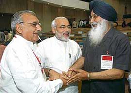 Chief Minister of Gujarat Narendra Modi and Haryana Chief Minister Bhupinder Singh Hooda greet Punjab Chief Minister Parkash Singh Badal at the inauguration of the conference of Chief Ministers and Chief Justices of High Courts at Vigyan Bhavan in New Delhi on Sunday. 