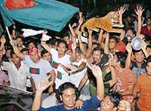 Bangladeshi cricket fans celebrate their teams victory over South Africa in Dhaka early on Sunday.