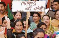 BJP workers demonstrate in front of the deputy commissioners office in Shimla on Monday.