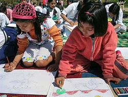 Students participate in a painting contest organised by the CRPF at Botanical Garden in the Zabarwan foothills in Srinagar on Monday.