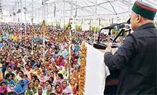 Chief Minister Virbhadra Singh addresses a gathering on the launch of the second phase of the National Rural Employment Guarantee Scheme for Kangra district, at Nurpur on Wednesday.