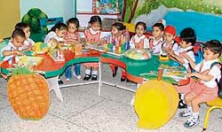 Tiny tots are told about the importance of vegetables and fruits at a nursery school in Ludhiana