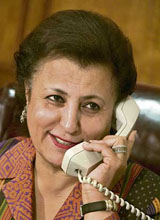 Kuwait's minister of education Nouriya Al-Sabeeh smiles in her office in Kuwait City on Thursday.
