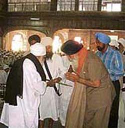 Punjab Chief Minister Parkash Singh Badal being presented a siropa at Baru Sahib gurdwara, near Rajgarh, on Friday