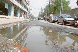 Water is accumulated on the road connecting Feroze Gandhi Market with Model Gram next to the Mini Secretariat