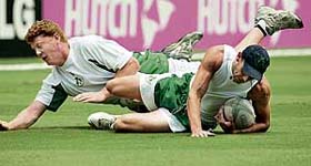 Irelands Kevin OBrien (left) and Paul Mooney play rugby during a practice session in Bridgetown