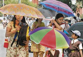 Mothers collect their children from a school in Chandigarh.