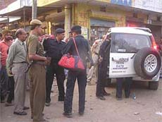 The car of the Haryana Chief Ministers security cover rams into two shops in Yamunanagar district on Monday