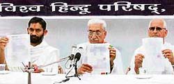VHP general secretary Ashok Singhal shows documents to substantiate his claim that the latest converts to Christianity in Lehra Gagga