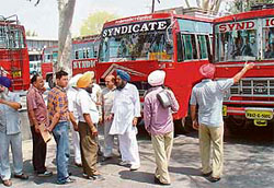Members of the CTU union block buses of Ambala Bus Syndicate at the Sector 17 ISBT in Chandigarh.