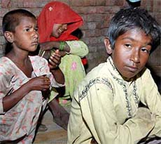 Grief-stricken Prakashi, mother of Rahul, with her other children at Rattak village, Karnal. Two-year-old Rahul was killed by his tantrik father in early hours on Tuesday at his village.