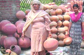 Pitcher-sellers await customers in Hargobind Nagar of Phagwara.