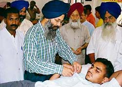 A volunteer donates blood at the blood donation camp organised by the Guru Gobind Singh Study Circle in Ludhiana