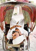 Who needs an AC: A rickshaw puller enjoys afternoon siesta unmindful of heat in Ludhiana