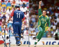Englands Andrew Flintoff walks back to the dressing room after being cleaned bowled by South Africas Andrew Hall (right) during a World Cup Super Eight match in Bridgetown