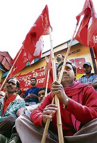 Members of CITU hold a dharna near The Mall in Shimla on Wednesday in protest against the price hike