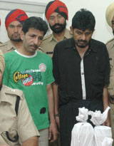 Balwinder Singh, alias Binder Lahoria, of Jalandhar and Gurdeep Singh of Ludhiana, who have been arrested by the police on the charge of possession 1 kg of heroin, in Jalandhar on Wednesday.