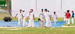 The pitch at Government College is covered as the tie between Ludhiana and Ropar in the Punjab State Inter-District Tournament