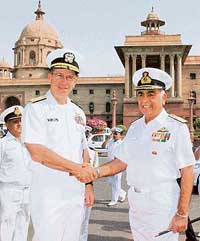 US Chief of Naval Operations Admiral Michel Mullen (left) shakes hands with Indian Naval Chief Sureesh Mehta as he arrives to inspect a guard of honour in New Delhi on Wednesday. 