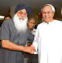Orissa Chief Minister Naveen Patnaik greets Punjab Chief Minister Parkash Singh Badal during the second meeting of the sub-committee of the National Development Council (NDC) on agriculture and related issues in New Delhi on Wednesday. 