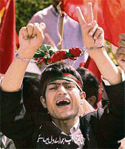 An opposition party activist shouts slogans at a rally against suspension of Chief Justice Iftikhar Chaudhry at the Supreme Court in Islamabad on Wednesday.