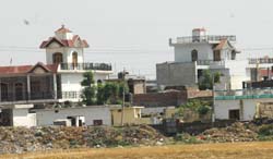 Such palatial houses, built by NRIs, tempt village youths in the Doaba belt to go abroad in search of greener pastures byadopting legal or illegal means to earn name and fame back home. 