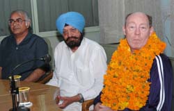 David Johnson (right) after being honoured at a function in Lyallpur Khalsa College. Also seen Balbir Singh, chief, governing council, and principal Satish Kapur.