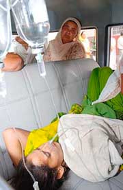 Manjit Kaur, whose three children were allegedly poisoned to death,being brought out of a private hospital at Kurukshetra on Friday. 