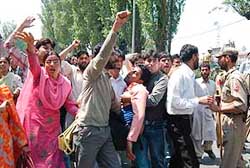 The Jammu and Kashmir police arrests contractual teachers protesting against the state government for not fulfilling their demands, in Srinagar on Saturday. 