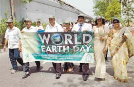Doctors take part in a rally to mark the World Earth Day in the Capital on Sunday