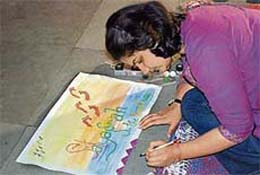 A student participates in a painting competition at Shimla on Sunday.
