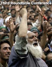 Participants at a rally shout slogans while welcoming Hurriyat Conference leader Syed Ali Shah Geelani in Srinagar on Sunday