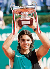 Spains Rafael Nadal poses with his trophy after winning against Swiss Roger Federer during their Monte Carlo ATP Masters Series final in Monaco.