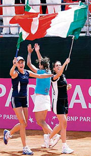 Mara Santangelo (left), Tathiana Garbin (centre) and Flavia Pennetta of Italy celebrate after defeating China in Fed Cup clash in Castellaneta Marina.