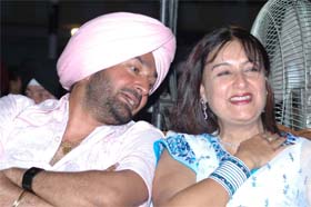 Punjabi actor Malkit Singh and Daljit Kaur share a lighter moment during the function in Amritsar.