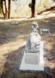 People carry away pieces from this marble tombstone at Dagshai to have a boy child