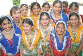 Students of St Soldier Divine Public School display their colourful costumes at a talent hunt contest in Jalandhar.