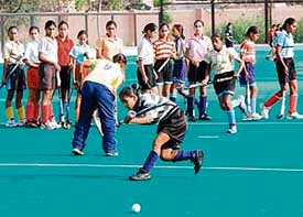 Hockey players from Shahbad go through their paces at the National Stadium in New Delhi on Tuesday. 