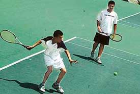 Harry S. Amor and Garry S. Amor of Chandigarh in action during the AITA Championship Series at the CLTA stadium on Wednesday. 