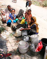 Residents of Mohra Mandi wait for their turn for water in Ambala.