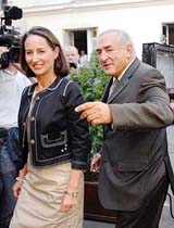 Segolene Royal , France's Socialist Party presidential candidate, arrives with former minister Dominique Strauss-Kahn at a restaurant in Paris on Wednesday. Royal faces conservative UMP Political Party presidential candidate Nicolas Sarkozy in the May 6 run-off vote. 