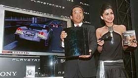 Sony India managing director Masaru Tamagawa launches PlayStation 3, as a model looks on in New Delhi.